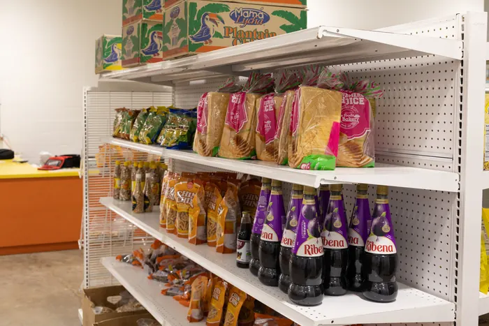 Shelf of sliced bread, chin chin snacks, and Ribena bottles at Afrimart