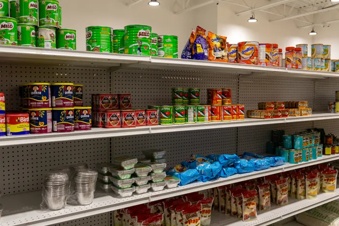 Shelf of Milo, Quaker oats, and canned fish at Afrimart